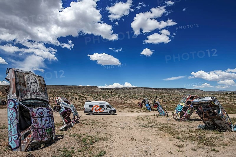 Motorhome and scrap cars decorated with graffiti in the Carforest of Goldfield, Nevada, USA, North America