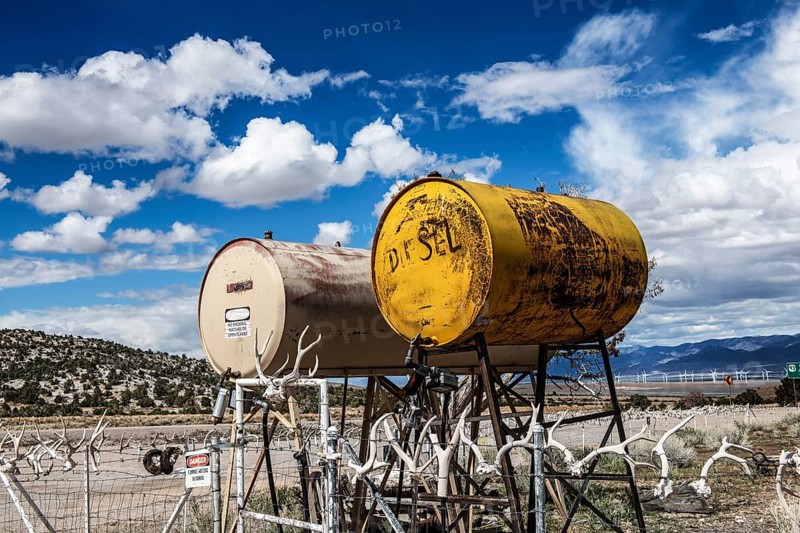 Truck stop with oil barrels and a fence of deer antlers, Highway 50, Loneliest Road in America, Ely, Nevada, USA, North America