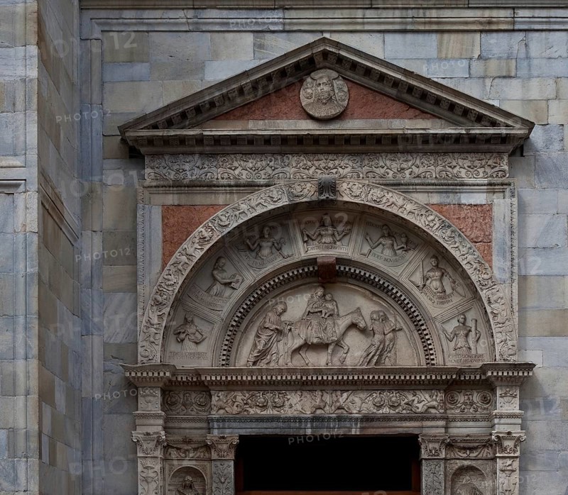 Italy Como Cathedral Gabled south portal c. 1500 by Jacopo and Tommaso Rodari in the tympanum Depiction of the Flight to Egypt, St., Saint, Saint