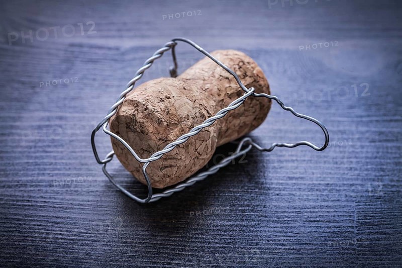 Close up view on corck of champagne with wire