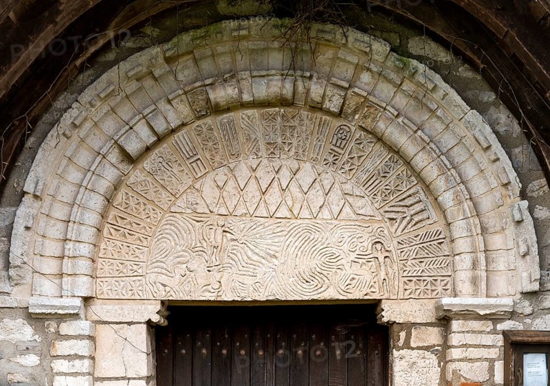 Portrait, Saint-Martin church from the 10th century (?) West portal, tympanum with labyrinth and paradise scene (?)