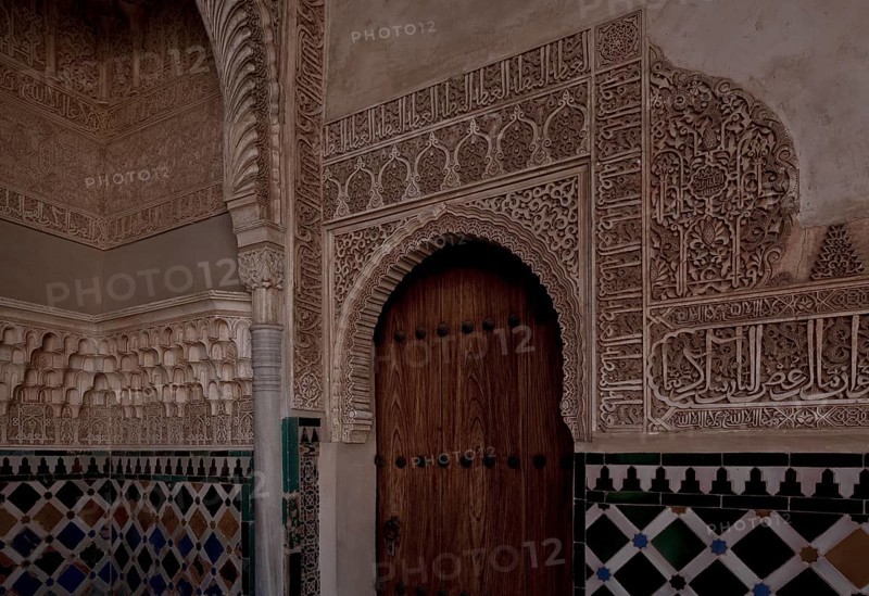 Nasrid Palace, wall design around a door with stucco framing and tiled plinth