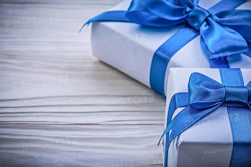 Composition of gift boxes on wooden board celebrations concept