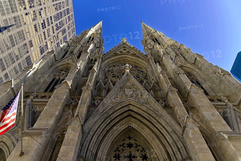Saint Patricks Old Cathedral or Old St. Patricks, Lower Manhattan, The facade of a Gothic church rises into the blue sky, Manhattan, Impressive facade of a Gothic cathedral with high towers under a blue sky, New York City, New York, USA, North America