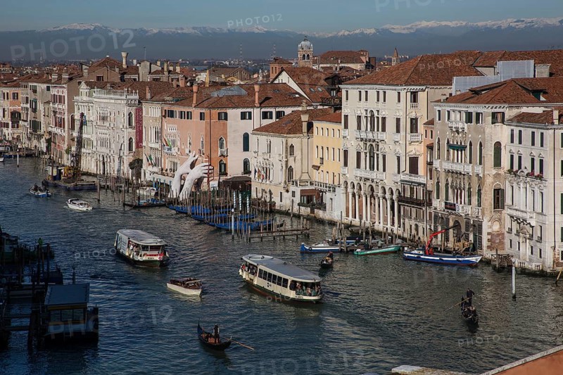 Venice, Grand Canal, view from the roof of the Fondaca dei Tedeschi to the north, to the right of the crane on the water Ca'd'Oro the monumental hands are an exhibit of the 2017 Biennale