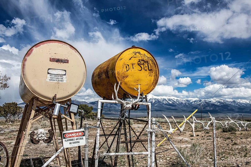 Truck stop with oil barrels and a fence of deer antlers, Highway 50, Loneliest Road in America, Ely, Nevada, USA, North America