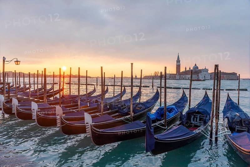 Cloudy atmosphere at sunrise, gondolas, San Giorgio Maggiore church in the background, Venice, Veneto, Italy, Europe