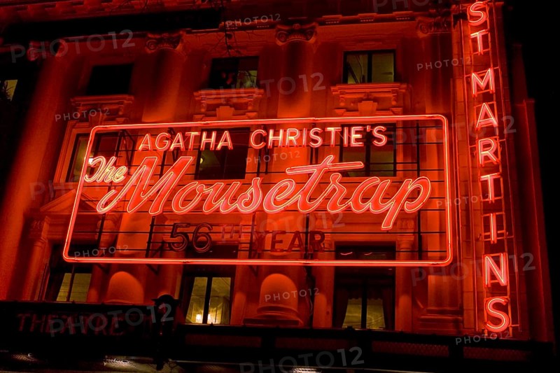 Agatha Christie Mousetrap at St Martins buildings illuminated red neon signboard, London, UK United Kingdom England