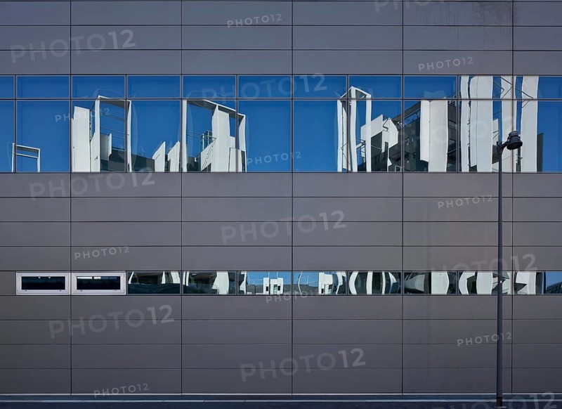 Residential development on Via Traiano, built in 2009-2014 by Guido Canali, reflection in the business centre