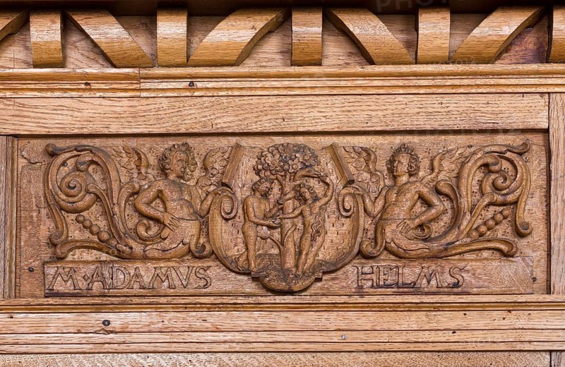 Scharbausaal, dormitory of the Franciscan monks, remodelled in 1618 - 1619 and furnished with ornate oak shelves as a library hall, carving by a donor: M ADAMUS HELMS