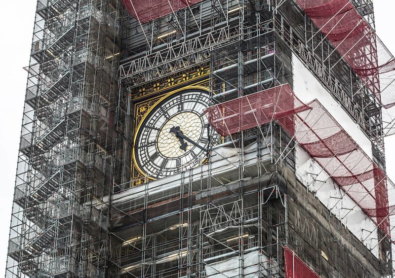 London, Big Ben clock face in the centre of the scaffolding