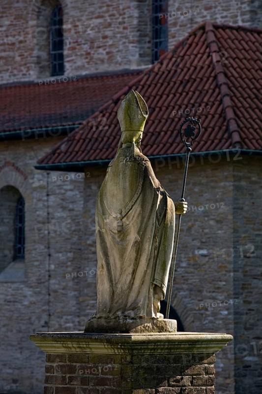Statue of Bishop Boniface in front of the collegiate church of St Boniface, Freckenhorst, Warendorf, Münsterland, North Rhine-Westphalia, Germany, Europe
