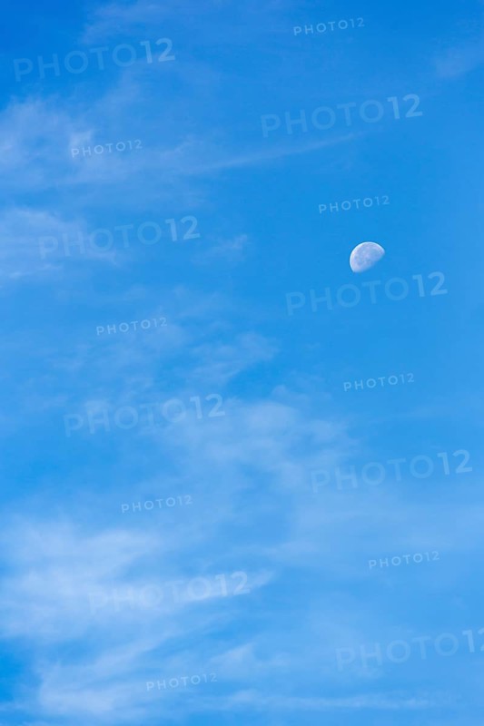 Light clouds in blue sky, waning moon, blurred, full-frame, East Sussex, South Downs, England, Great Britain