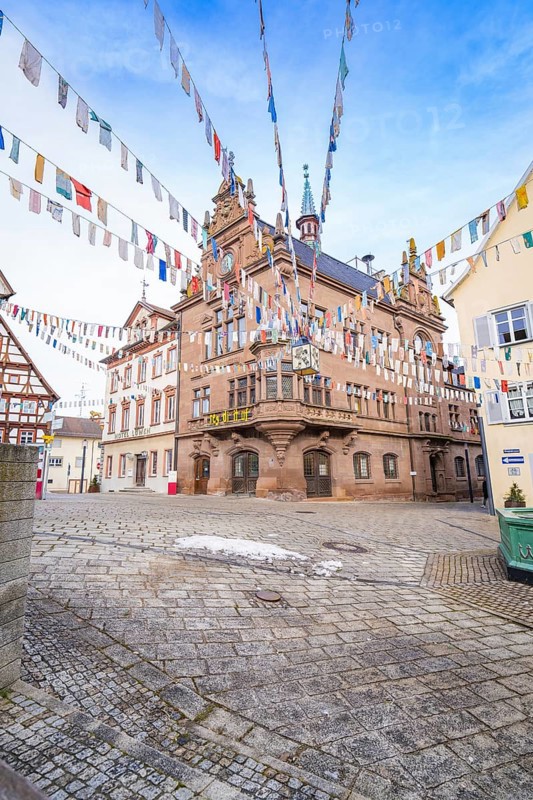 Historic building with colourful pennants on a square surrounded by half-timbered houses, Meßkirch, Sigmaringen district, Germany, Europe