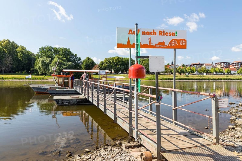 Passenger on the ferry pier at the entrance to the ferry on the Promnitz side, in the background the banks of the Elbe in Riesa, Saxony, Germany, Europe
