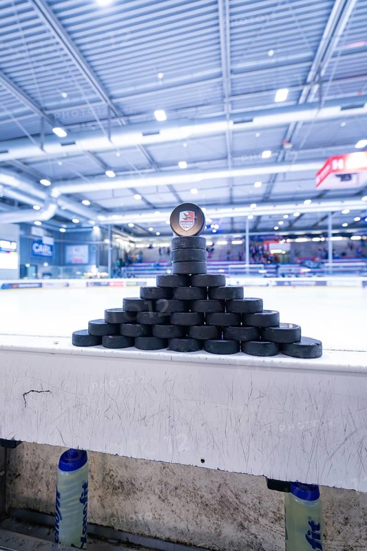 Pyramid-shaped stacked ice hockey pucks in a large ice rink, Heilbronner Falken Vs Bietigheimer Steelers, Heilbronn, Germany, Europe