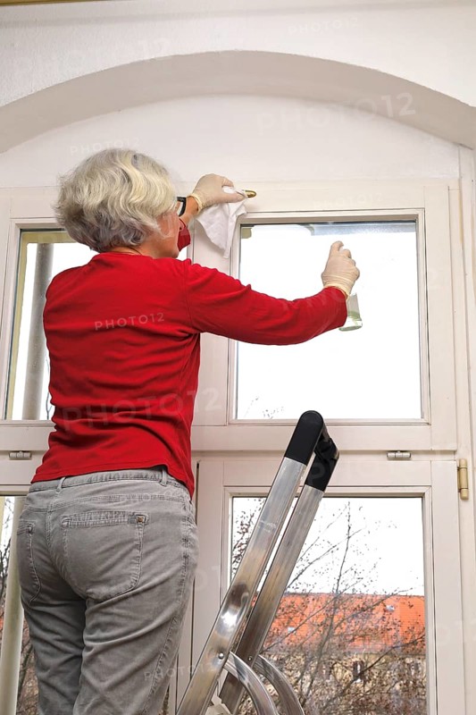 Cleaning flat windows, Germany, Europe