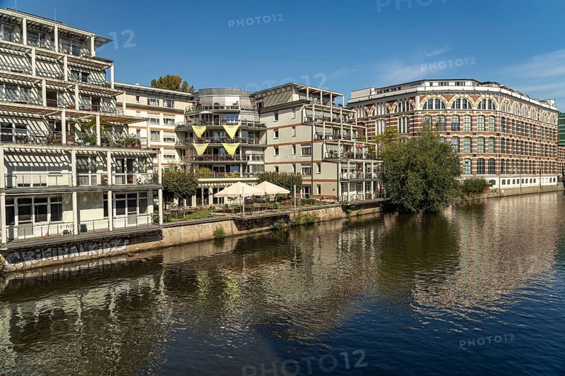Elster Lofts residential building and the Weiße Elster river in Leipzig, Saxony, Germany, Europe