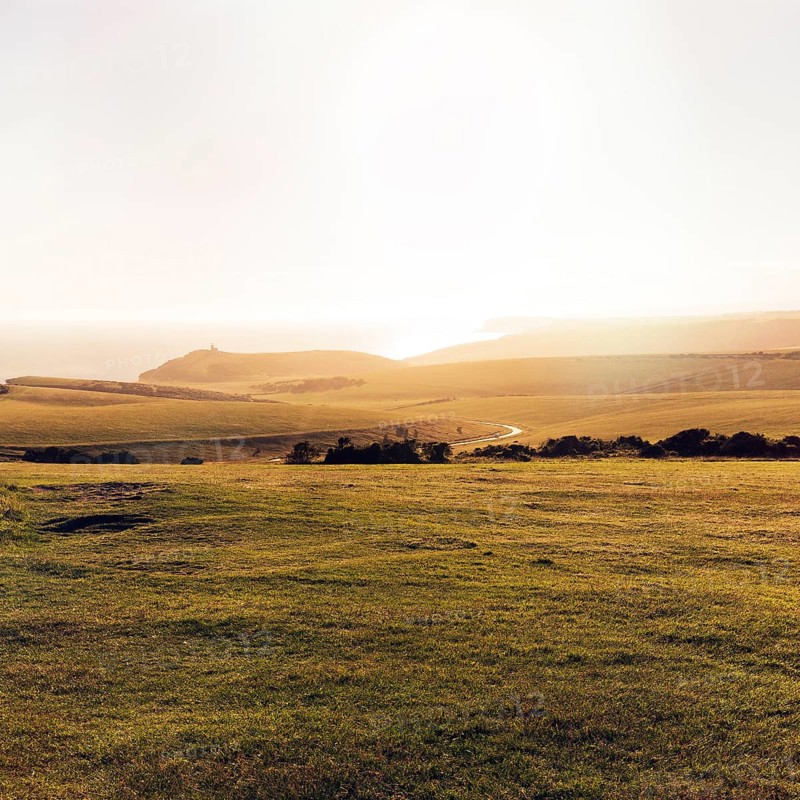 Coastline with view towards Belle Tout, backlight, sunbeam, text free space, Eastbourne, South Downs, East Sussex, England, Great Britain