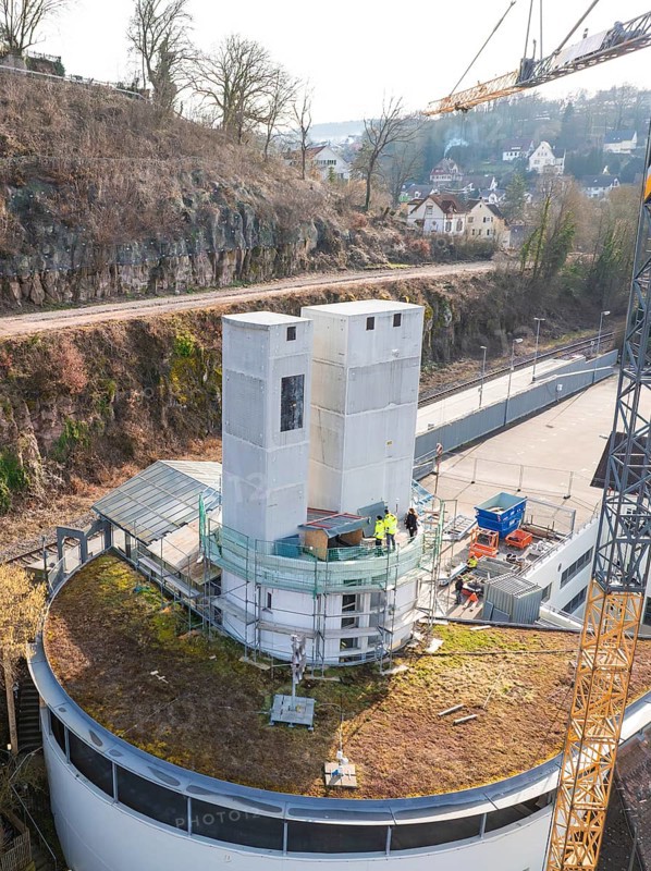 Construction site with two large concrete towers and a crane in an urban environment, extension of the ZOB Calw tower onto the new track of the Hermann Hesse railway, Calw, Black Forest, Germany, Europe