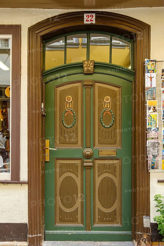 Richly decorated and ornamented front door of a building on the Krämerbrücke in the historic city centre of Erfurt, Thuringia, Germany, for editorial use only, Europe