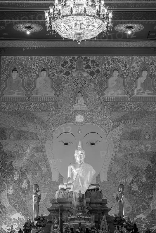 Golden Buddha statue with tunic, Bhumispara-mudra, Buddha Gautama at the moment of enlightenment, art gallery with exhibition of non-traditional artworks, most of which follow modern art trends such as minimalism and abstraction, Wat Sitthawararam, Bangkok, Thailand, Asia