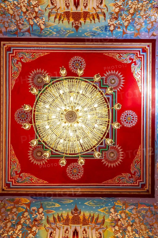 Frog's-eye view: Ceiling with chandelier of an art gallery with an exhibition of non-traditional artworks, most of which follow modern art trends such as minimalism and abstraction, Wat Sitthawararam, Bangkok, Thailand, Asia