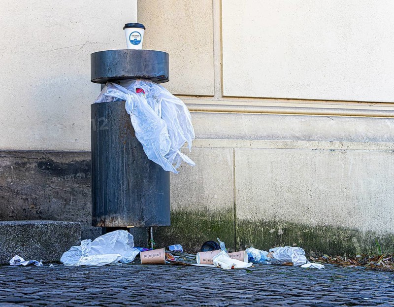 Overfilled rubbish bin in the public street, Berlin, Germany, Europe
