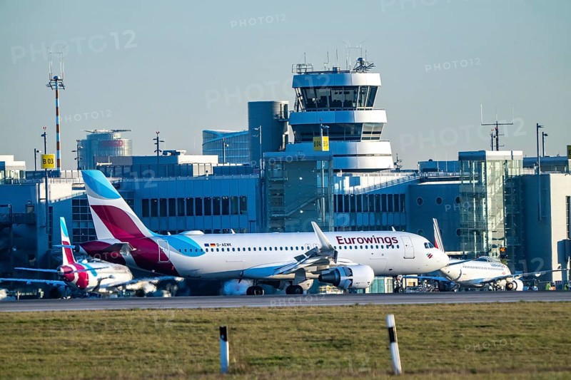 Eurowings Airbus aircraft on the taxiway, apron of Düsseldorf International Airport, old air traffic control tower, North Rhine-Westphalia, Germany, Europe