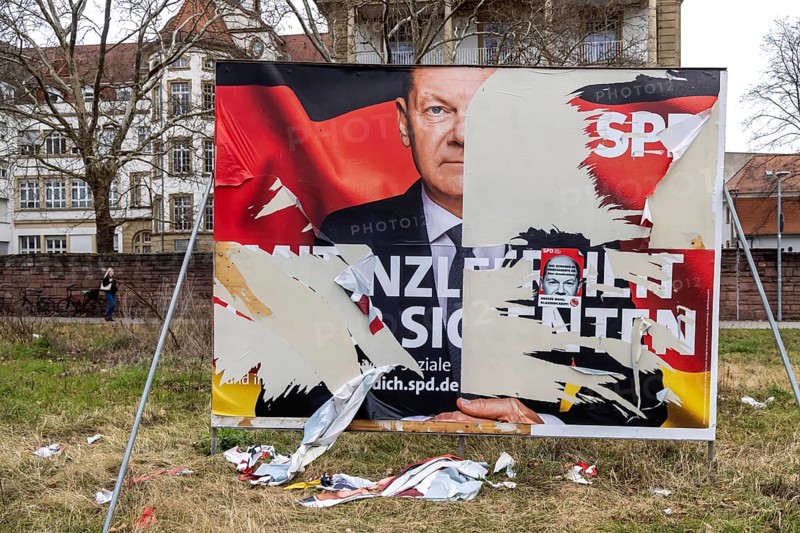 Election poster of the SPD party with Olaf Scholz for the Bundestag election 2025. BTW25. The large poster was destroyed by vandals, it is a symbol for the failed Federal Chancellor. Karlsruhe, Baden-Württemberg, Germany, Europe