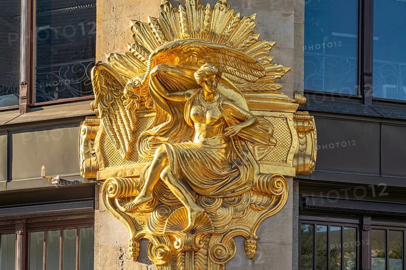 Gilded façade element with the allegory of hedonism on the former Art Nouveau department stores' Ebert in Leipzig, Saxony, Germany, Europe