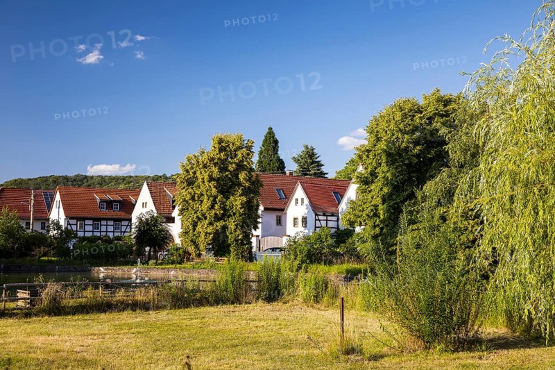 Village view of Naundorf, historic buildings with farmhouses, village green with pond, Radebeul, Saxony, Germany, Europe