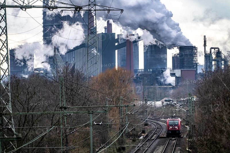 Prosper coking plant, operated by the ArcelorMittal steel group, 146 coke ovens with a daily output of 5500 tonnes of coke, extinguishing cloud, railway line for freight traffic, electric locomotive, Bottrop, North Rhine-Westphalia, Germany, Europe