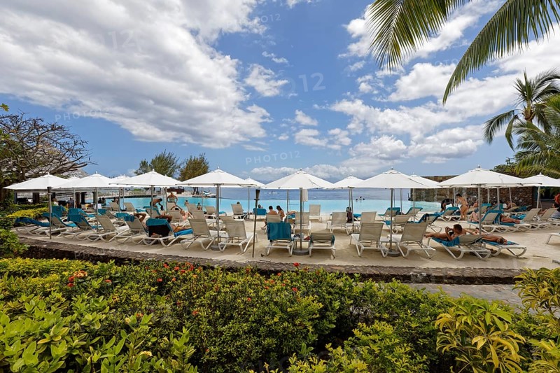 People on sun loungers, parasol, infinity pool, Te Moana Tahiti Resort, hotel, Tahiti-Nui, Tahiti, Society Islands, Leeward Islands, French Polynesia, Oceania