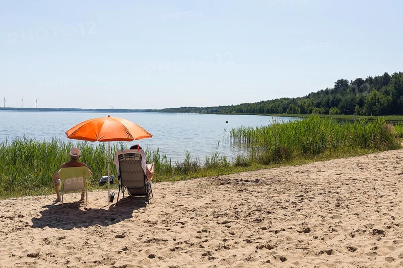 On the shore of the Scheibe-See, open-cast mining pit, which is now open for swimming, Hoyerswerda, Saxony, Germany, Europe