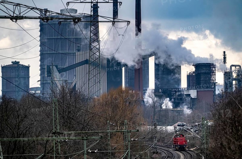 Prosper coking plant, operated by the ArcelorMittal steel group, 146 coke ovens with a daily output of 5500 tonnes of coke, extinguishing cloud, railway line for freight traffic, diesel locomotive, Bottrop, North Rhine-Westphalia, Germany, Europe