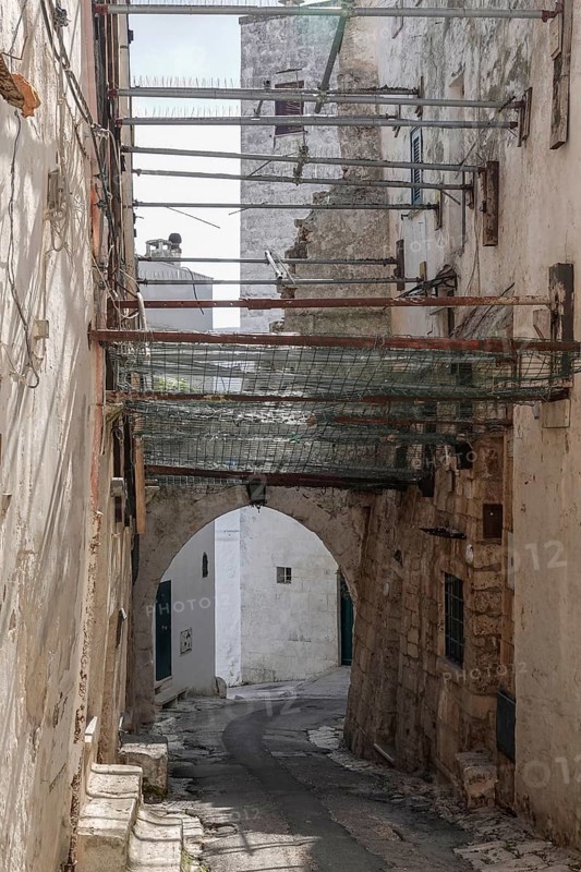 Alley in the historic centre of Ostuni, securing historic building, Ostuni, Apulia, Italy, Europe