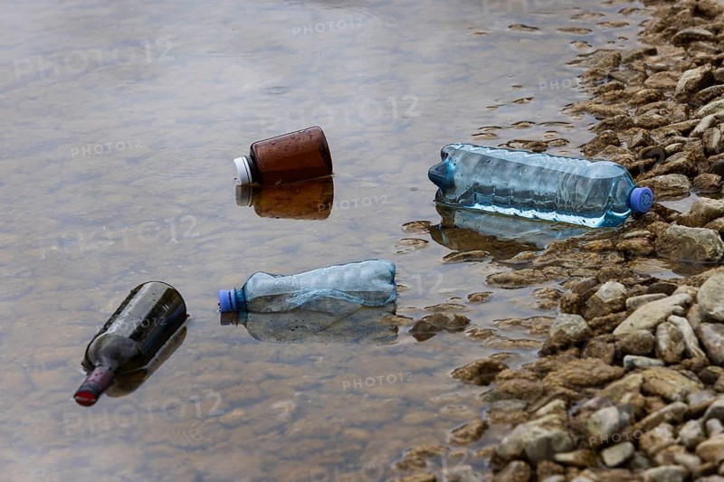 Environmental pollution, Household waste washed up on the lake shore, Plastic and glass bottles, Austria, Europe