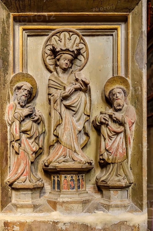 Stone relief of a group of three, Mary with baby Jesus flanked by two apostles, Church of St Severus in Erfurt, Thuringia, Germany, for editorial use only, Europe