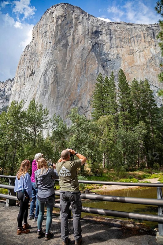 Yosemite National Park, California - Tourists watch rock climbers on El Capitan, a frequently-climbed rock wall above Yosemite Valley in Yosemite National Park
