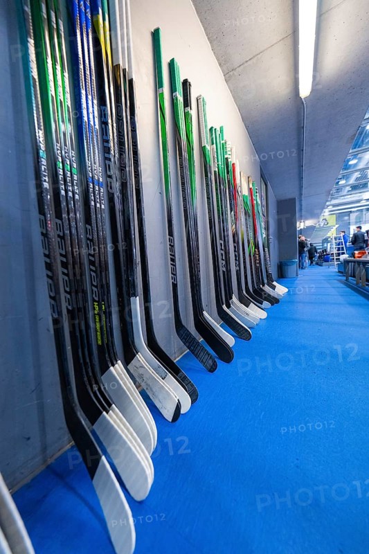 Ice hockey sticks in different colours leaning neatly against a wall in a hall, Heilbronner Falken Vs Bietigheimer Steelers, Heilbronn, Germany, Europe