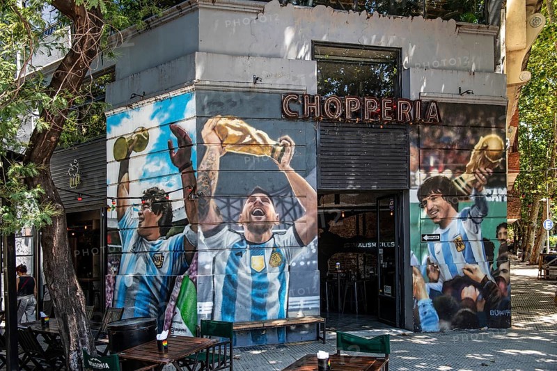 Lionel Messi with World Cup trophy on the wall of a house at El Caminito, La Boca, Buenos Aires, Argentina, South America
