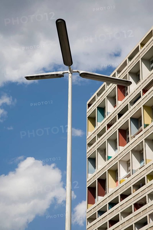 Section of façade with contemporary street lamp