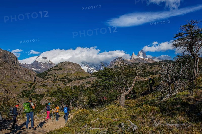 Trekkers at Cascada Martin with a view of the Fitzroy Massif, El Chaltén, Los Glaciares National Park, Santa Cruz, Patagonia, Argentina, South America