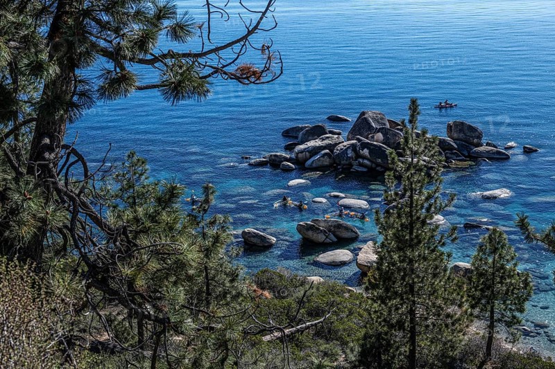 Kayakers at the Bonsai Rocks, Sapphire Cove, Lake Tahoe, Nevada, USA, North America