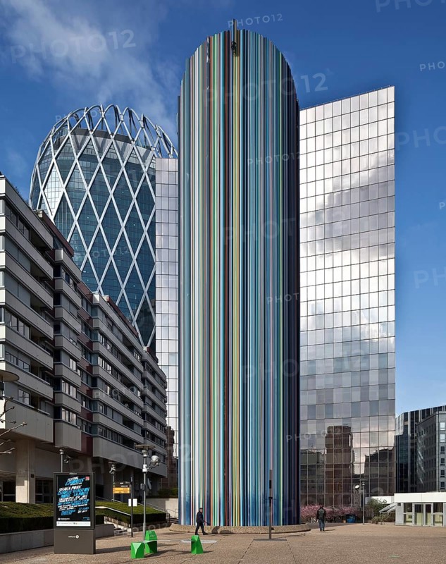 Ventilation chimney, 1990-95 by Raymond Moretti, encased in hundreds of coloured fibreglass tubes 32 m high