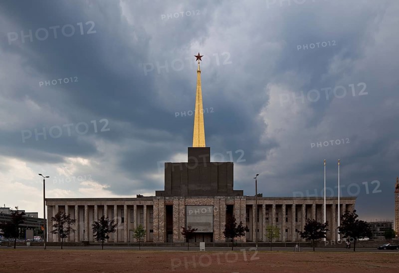 Exhibition hall 1923-1924 with pillared porch in front, 1950-51 tower construction with gilded spire and Soviet star