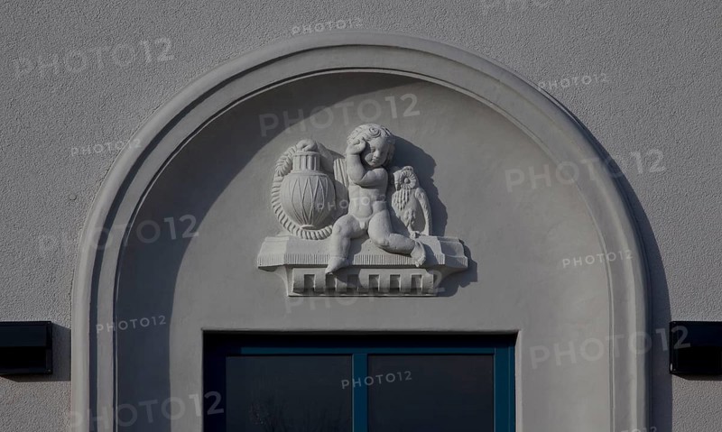 Built in 1913, IBA project 2010, exterior ornamentation, putto with lamp and owl