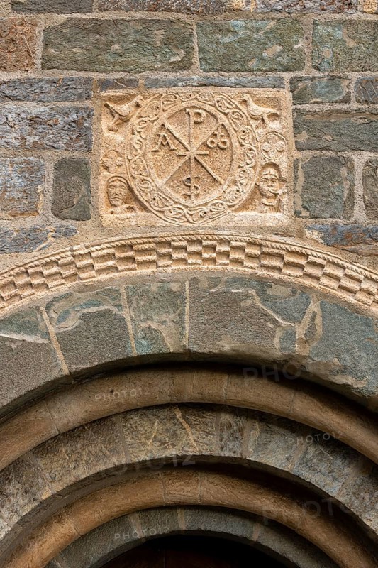 Coll, Santa Maria de l'Assumpció, west portal with Christ's monogram