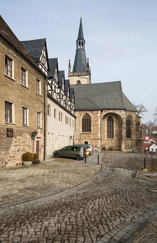 Luther city Eisleben, St Anne's Augustinian monastery View of the monastery from the east with the dwarf houses. Choir and spire of St Anne's Church in the background